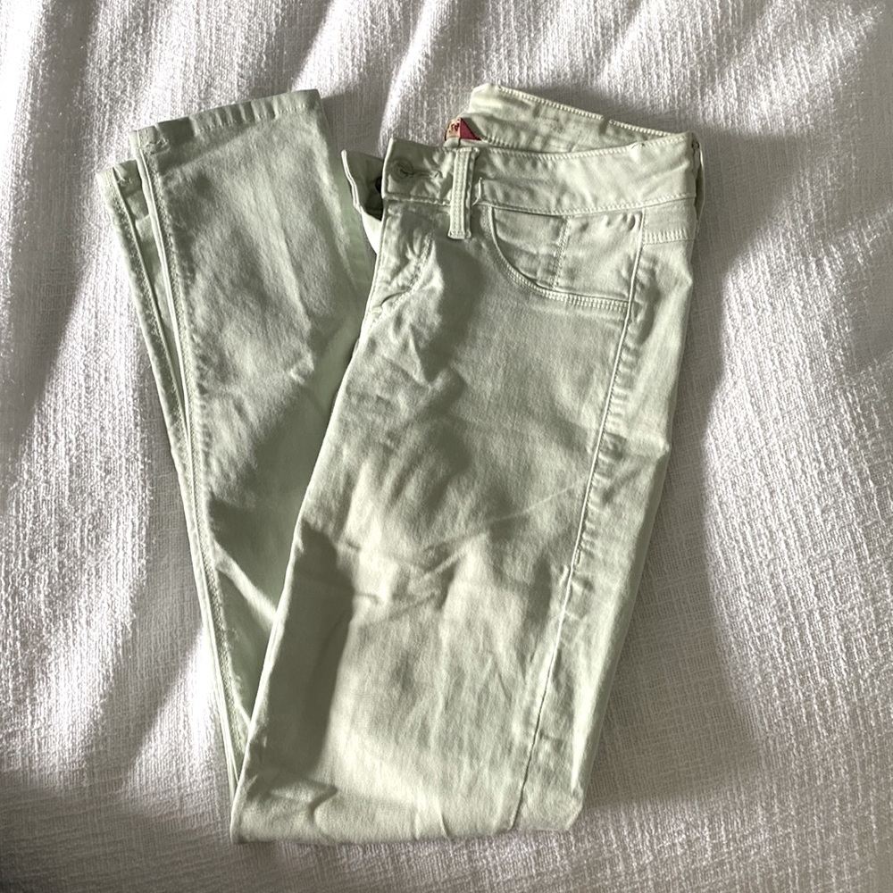 Light mint colored skinny jeans